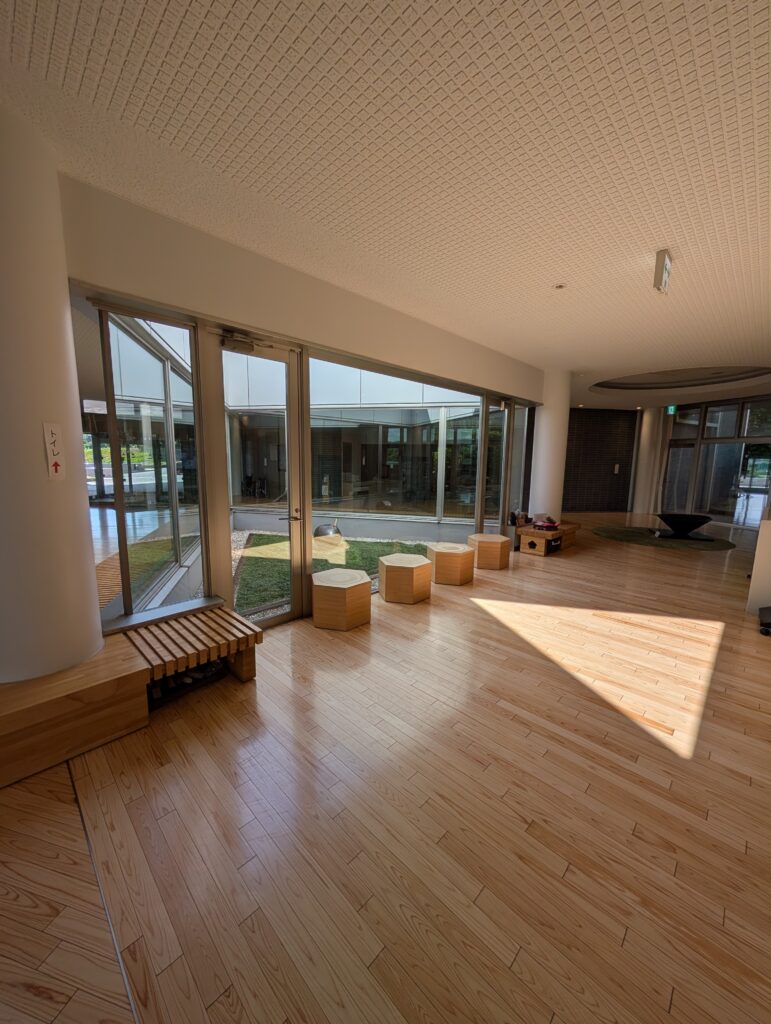 triangular light from atrium shining on wooden floor
