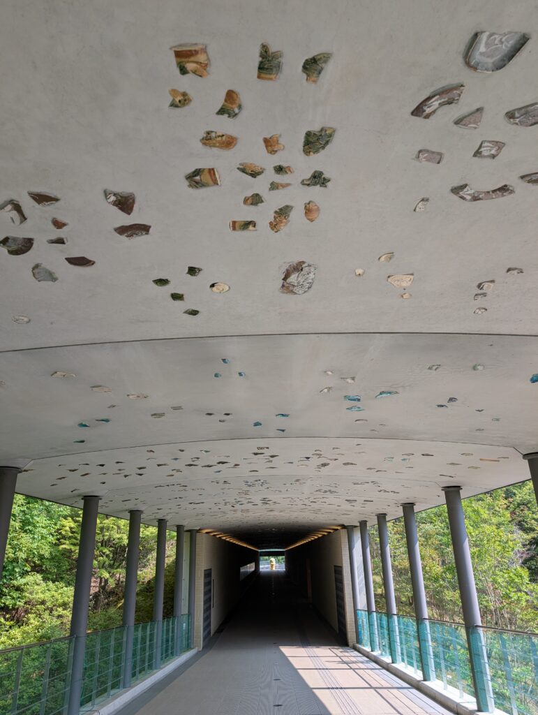 suspension walkway of Museum of Modern Ceramic Art with cement overhand embedded with local ceramic scraps