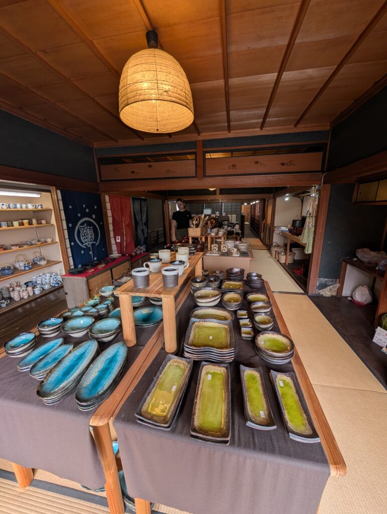 display of colorful functional ceramics in tatami mat traditional Japanese style shop