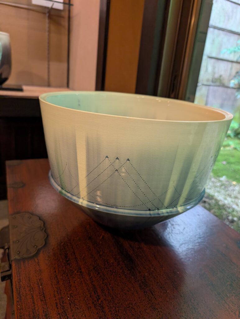 porcelain bowl with rust colored glaze by Kobei Kato the seventh generation