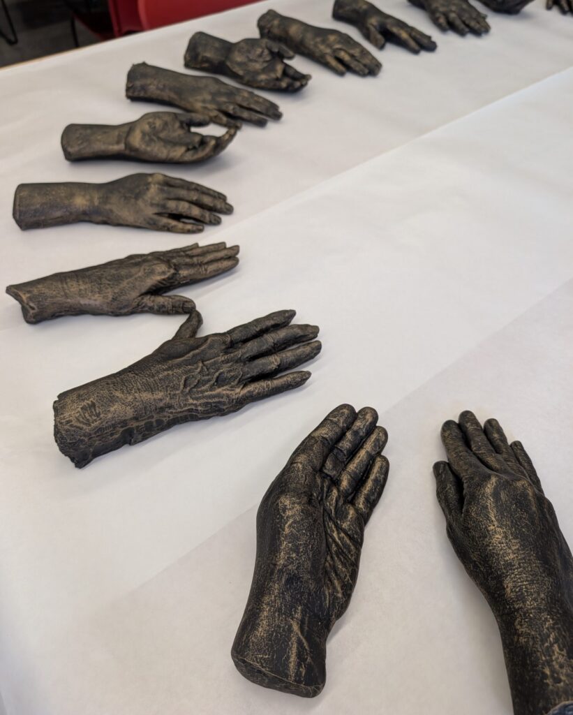 half circle of free hand ceramic resin bronze sculptures