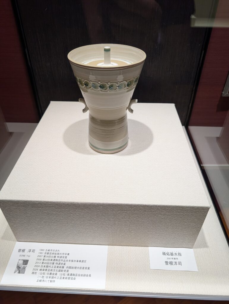 angular lidded jar with raised slip trail decoration